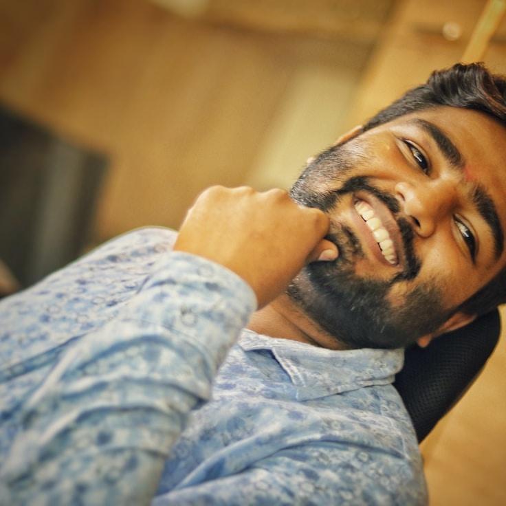 Alex Reed, Lead Design Curator at Voyage Candle Park, reviewing corporate floral arrangements